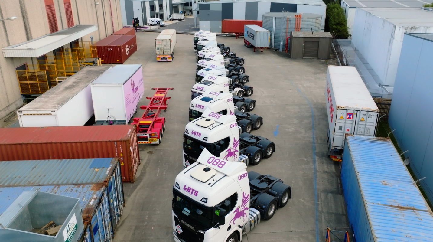Aerial view of the real LOTS branded Scania truck fleet and container yard